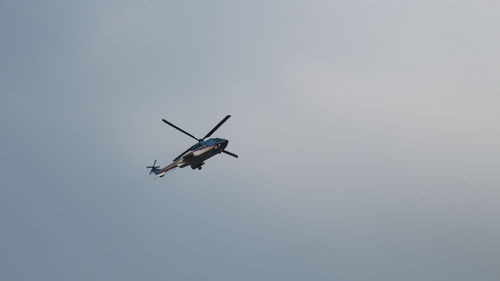 Low angle view of helicopter at sky