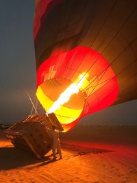 Hot air balloon at beach during sunset
