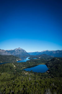 Scenic view of mountains against clear blue sky