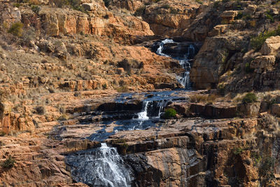 Natural rocky terrain river cascade