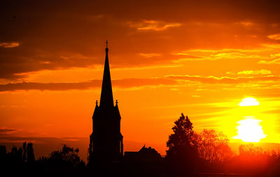 Silhouette of building at sunset