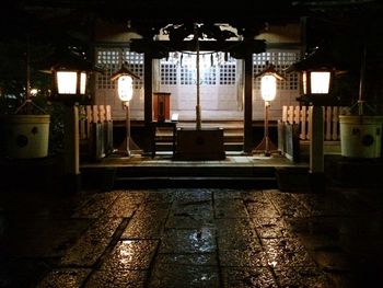 Illuminated lamp in city at night