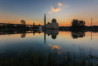 Scenic view of lake against sky during sunset