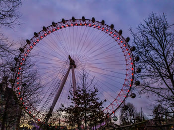 Low angle view of ferris wheel against sky