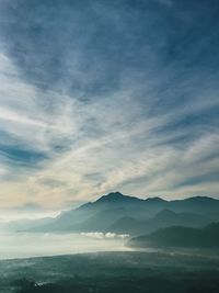 Scenic view of silhouette mountains against sky