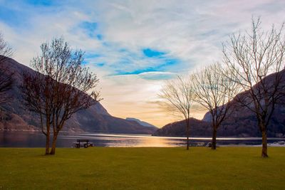 Scenic view of lake and mountains during sunrise