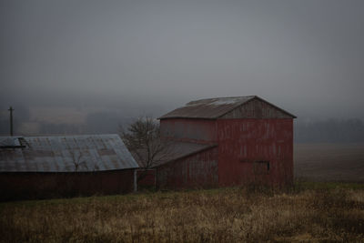 House on field against sky