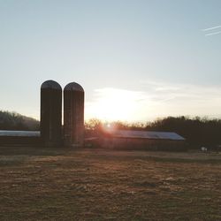 Scenic view of field against sky during sunset