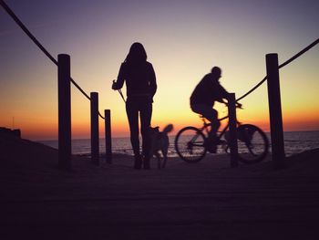 Silhouette of woman at sunset