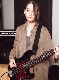 Young woman playing guitar