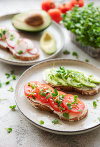 Different sandwiches with vegetables and microgreens. healthy food