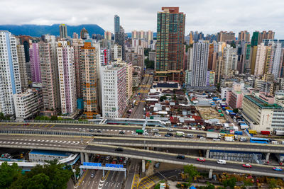 High angle view of street amidst buildings in city