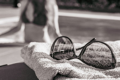 Close-up of eyeglasses on road