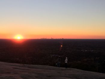 Scenic view of landscape against sky during sunset