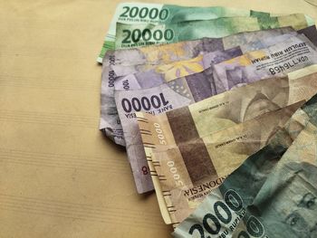 High angle view of banknotes on table
