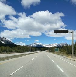 Road by highway against sky