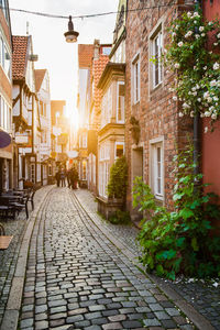 Street amidst buildings in city against sky