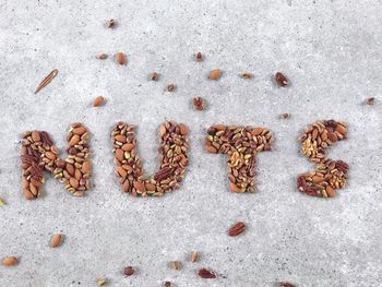 Directly above shot of nuts text on table