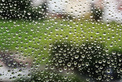 Full frame shot of wet glass window