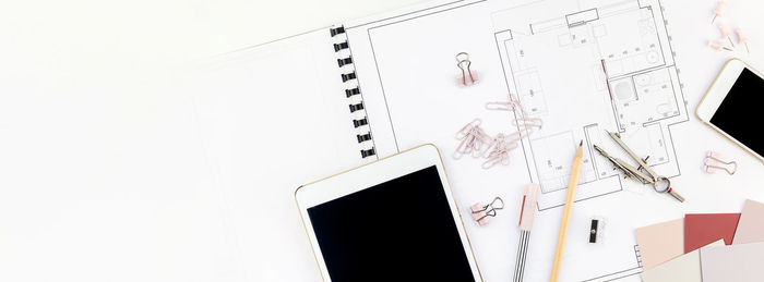 Low angle view of pen on table against white background