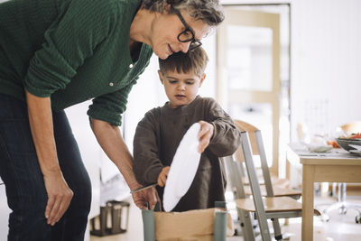 Side view of young man working at home