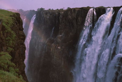 Panoramic view of waterfall against sky