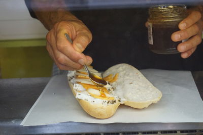 Close-up of man preparing food