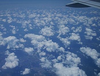 Aerial view of landscape against blue sky