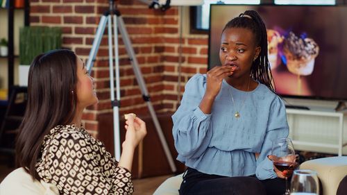 Side view of mother and daughter in park