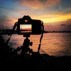 Scenic view of sea at sunset