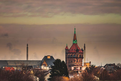 Cathedral against cloudy sky during sunset