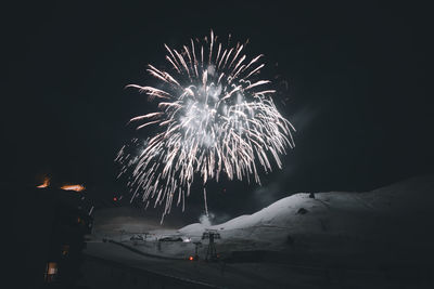 Firework display at night