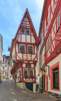 Street amidst buildings against sky