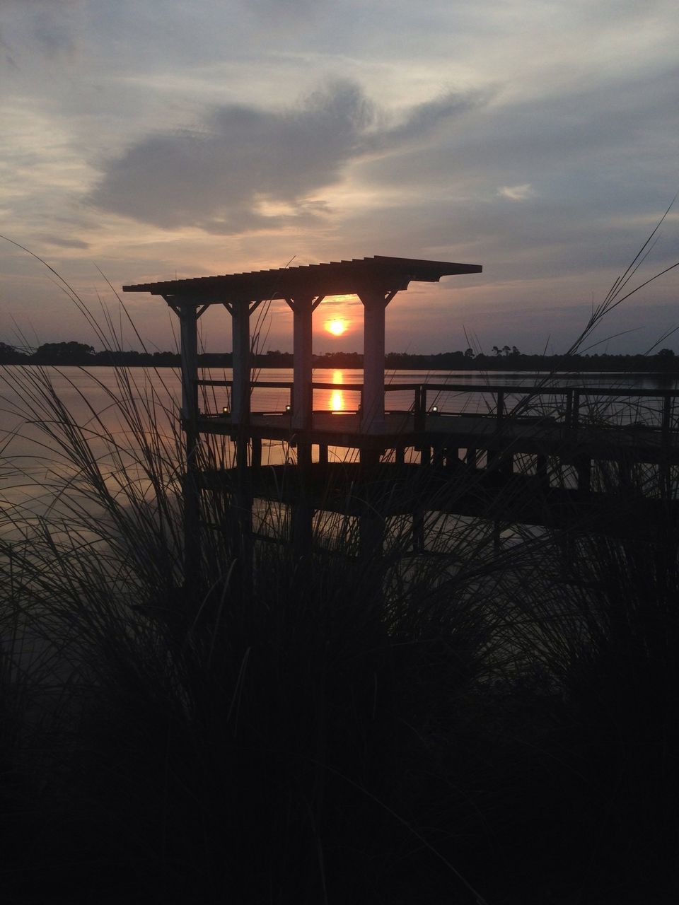 sunset, sky, built structure, architecture, building exterior, silhouette, cloud - sky, house, nature, tranquility, sun, outdoors, tree, water, no people, tranquil scene, orange color, reflection, dusk, sunlight