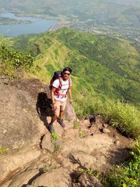 High angle view of man standing on mountain