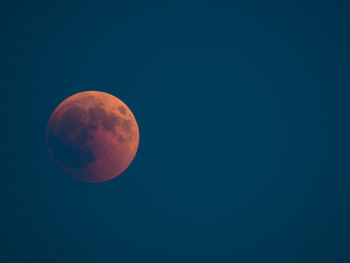 Scenic view of moon against blue sky