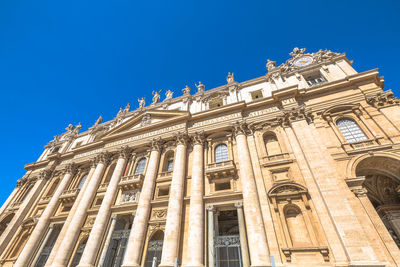 Low angle view of historical building against blue sky