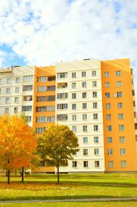 Residential buildings in city against sky