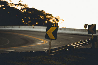 Close-up of road sign against clear sky