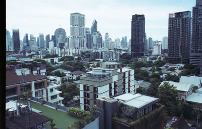 High angle view of buildings in city against sky