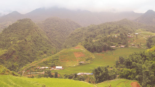 High angle view of agricultural field against mountains