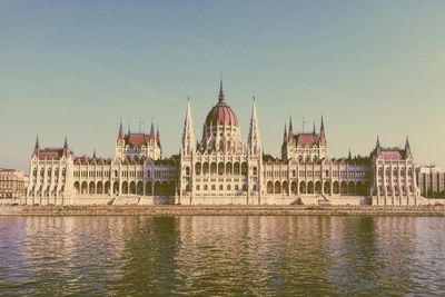 Hungarian parliament building and danube river against sky