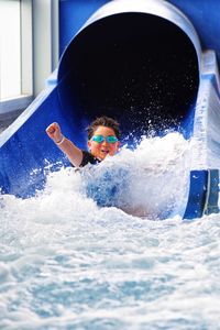 Boy enjoying water slide