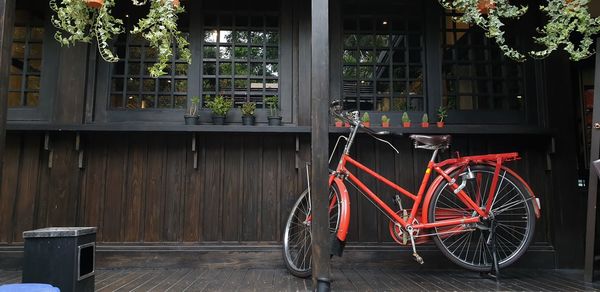 Bicycle parked by building