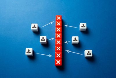 Directly above shot of dices on blue background