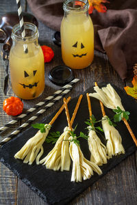 Halloween funny idea for party food. halloween creative cheese snack on a wooden table.