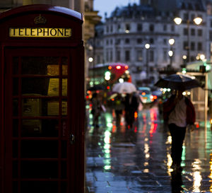 Red telephone booth on street