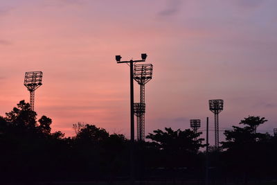 Silhouette tower against sky during sunset