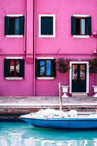 View of pink and building in city