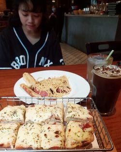 Midsection of man having food in restaurant